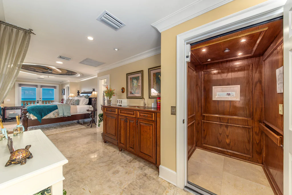 Take the elevator to the 4th floor master bedroom suite (the full 4th level).