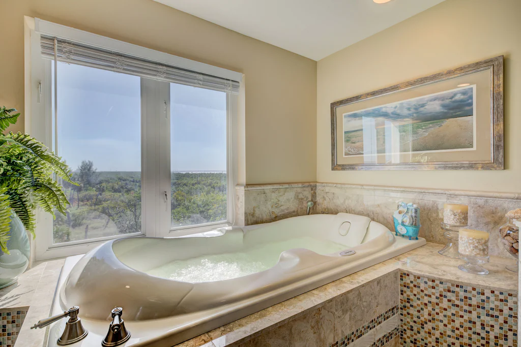 Jetted Jacuzzi therapeutic tub in the Master Bath. Relax and enjoy the beach and river views!