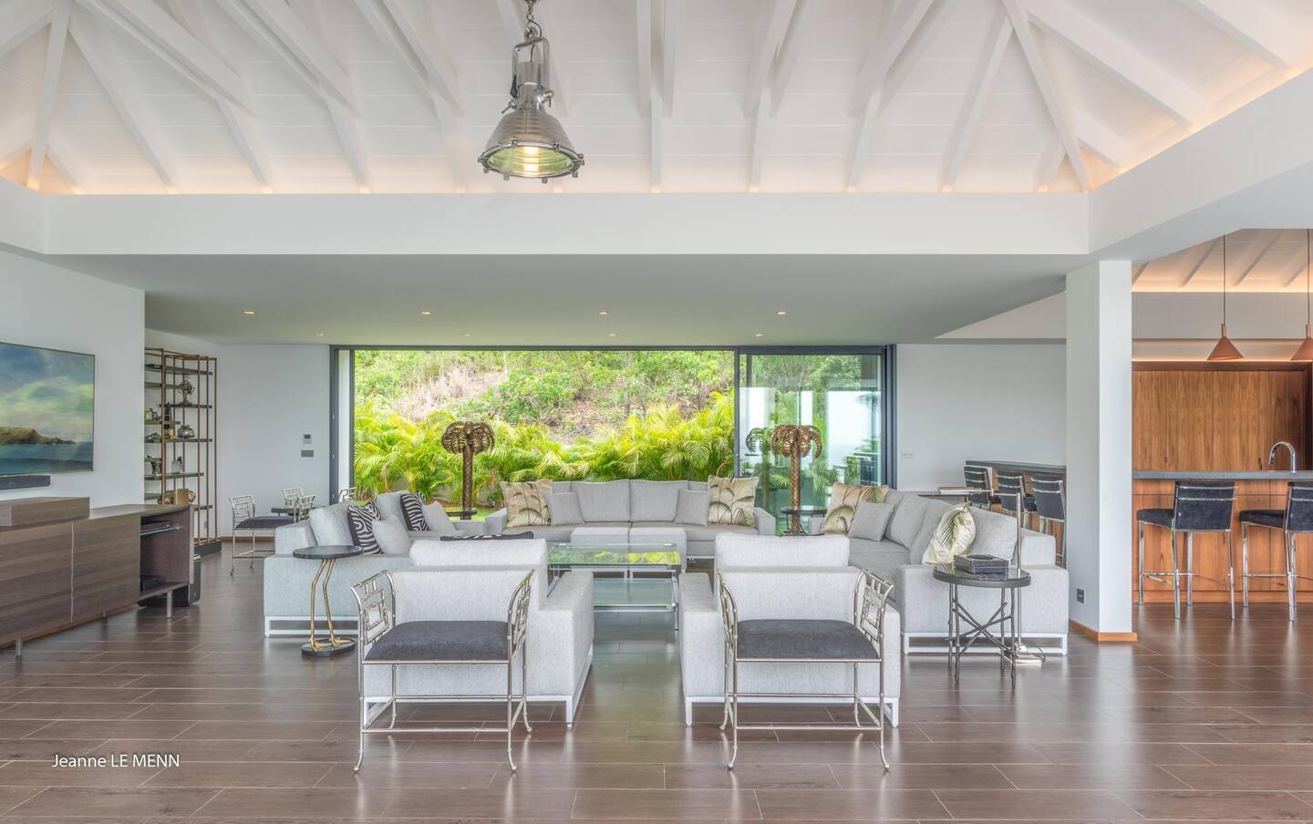 The open-plan interior seamlessly transitions into the patio.