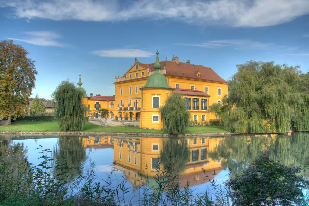 Airbnb Castle In Europe - Located by a pond, this castle will give you the romantic and classic feels ideal for couples or with your friends.