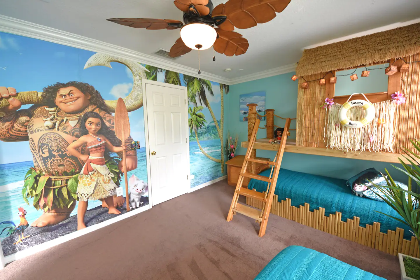 Ocean scene with Maui and Moana's Tiki playhouse (twin) and Moana's boat bed (queen).