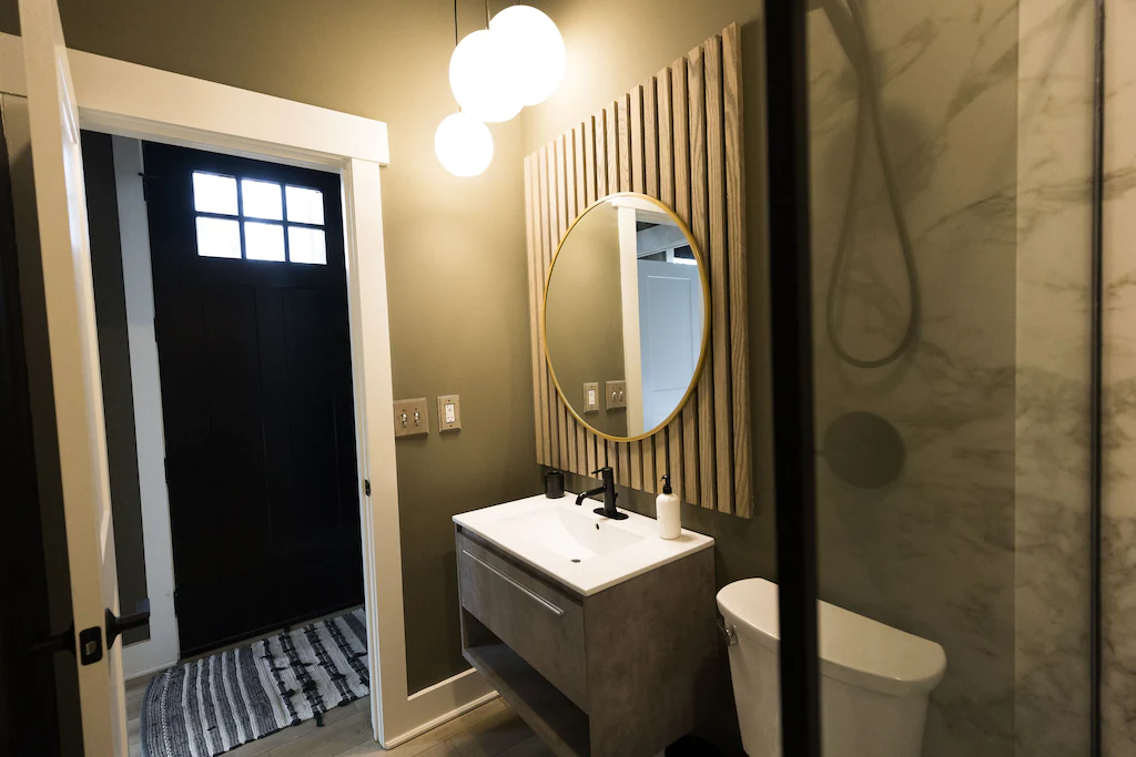 The full bath features a shower, 30" vanity, and modern touches.
