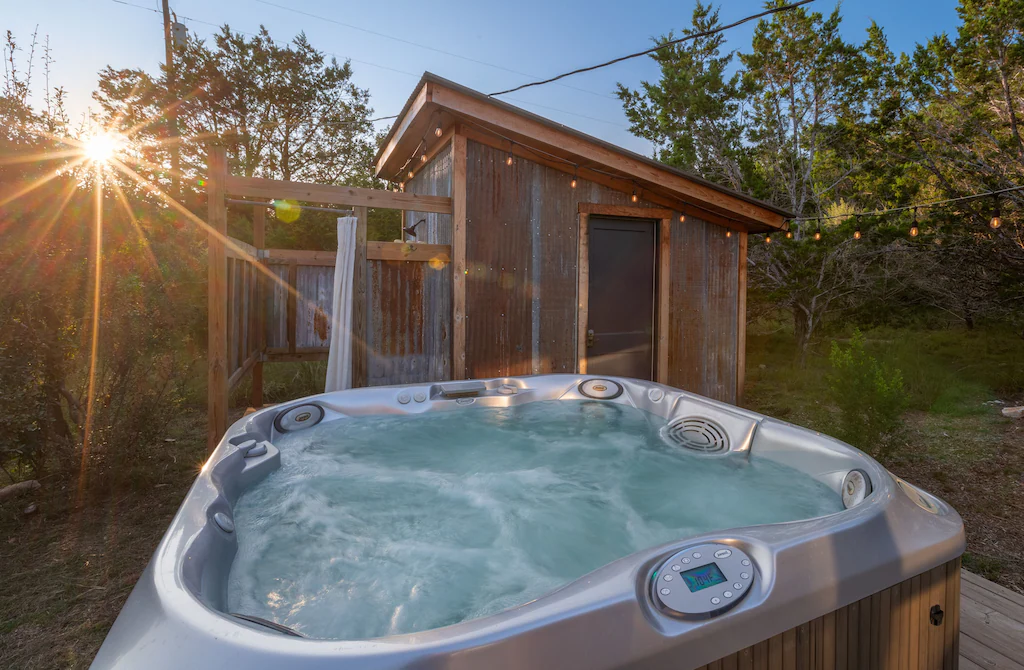A private hot tub along with an outdoor shower.