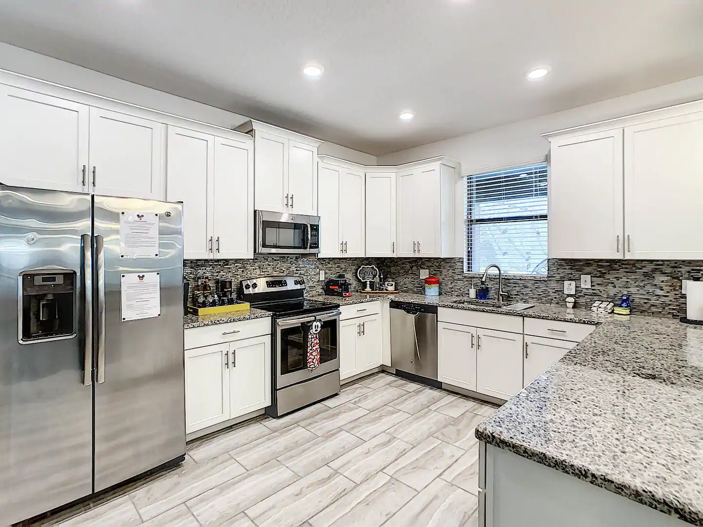 Large, fully-equipped kitchen with high-quality appliances and utensils.