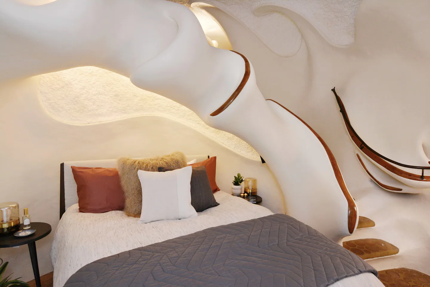 A queen-sized bed is located in the sleeping room.