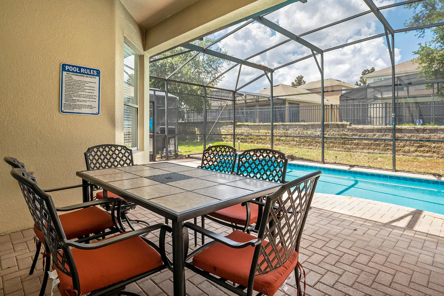 There is plenty of outdoor furniture surrounding the pool, providing a comfortable place for individuals who want to enjoy the sunshine in Florida.