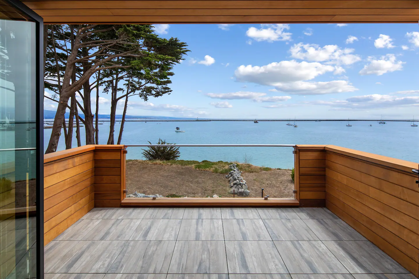 The deck has a panoramic view of the beach.