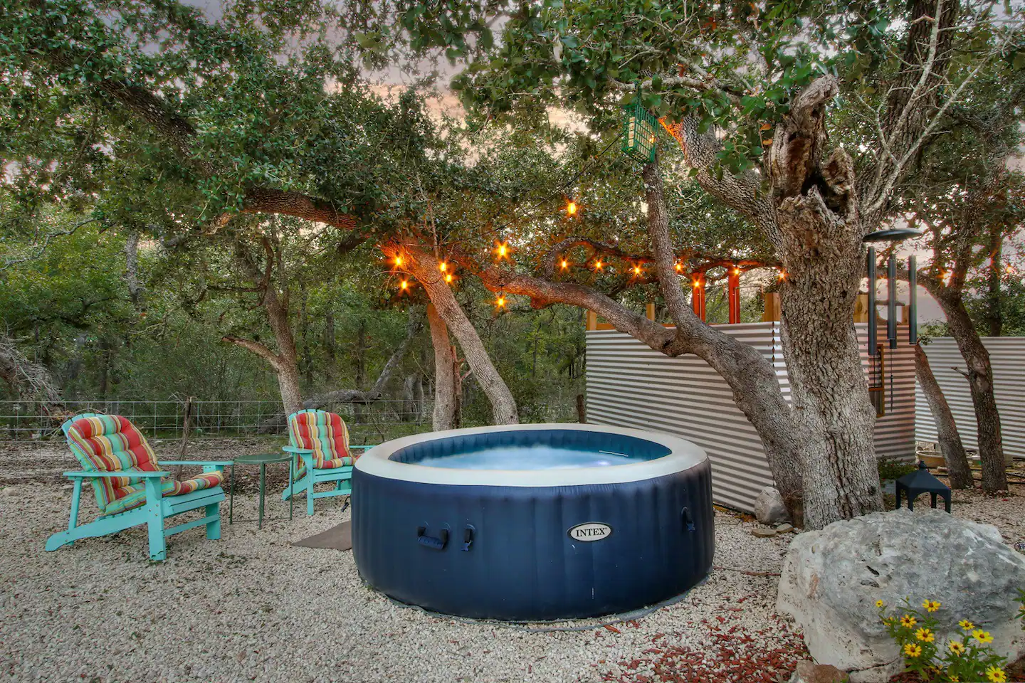 The hot tub beneath the trees is fantastic.