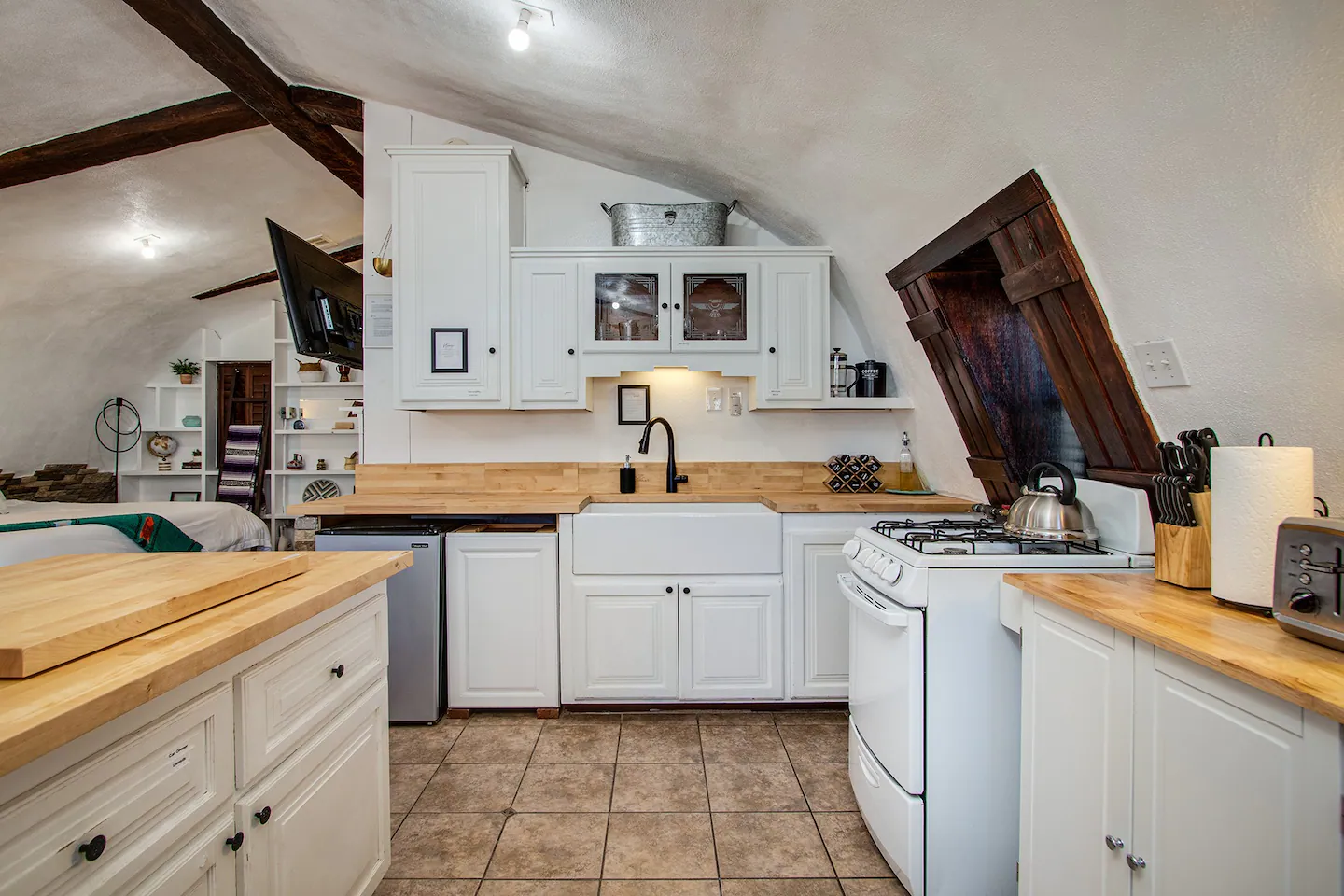 Complete kitchen with high-efficiency appliances, utensils, cookware, and prep equipment.