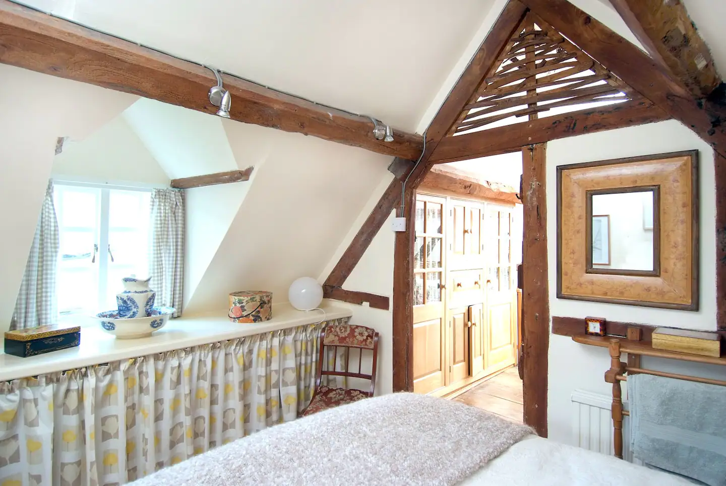 Look out the dormer window from your bed - there's extra storage space underneath it.