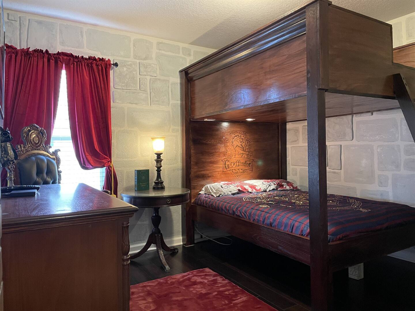 The Gryffindor dorm has a unique canopy bunk bed with two full-sized beds.