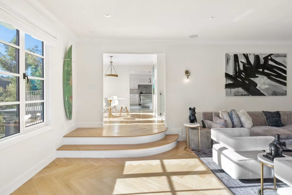 Beautiful hardwood flooring and artwork combine to create an imaginative retreat.