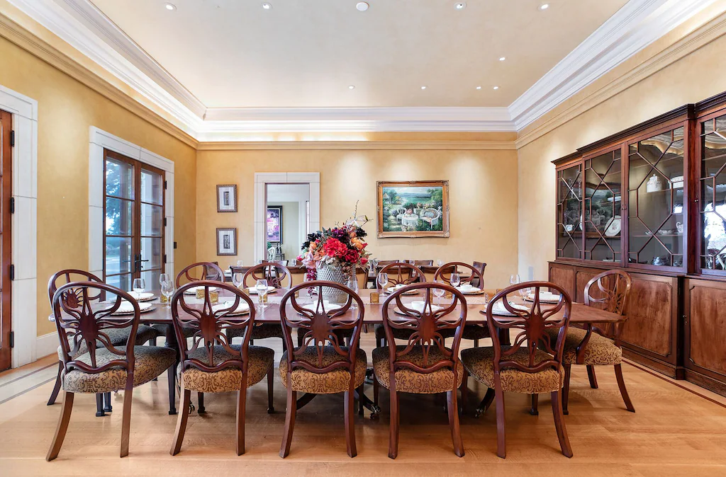 Our formal dining area accommodates 24 people across two large formal tables.