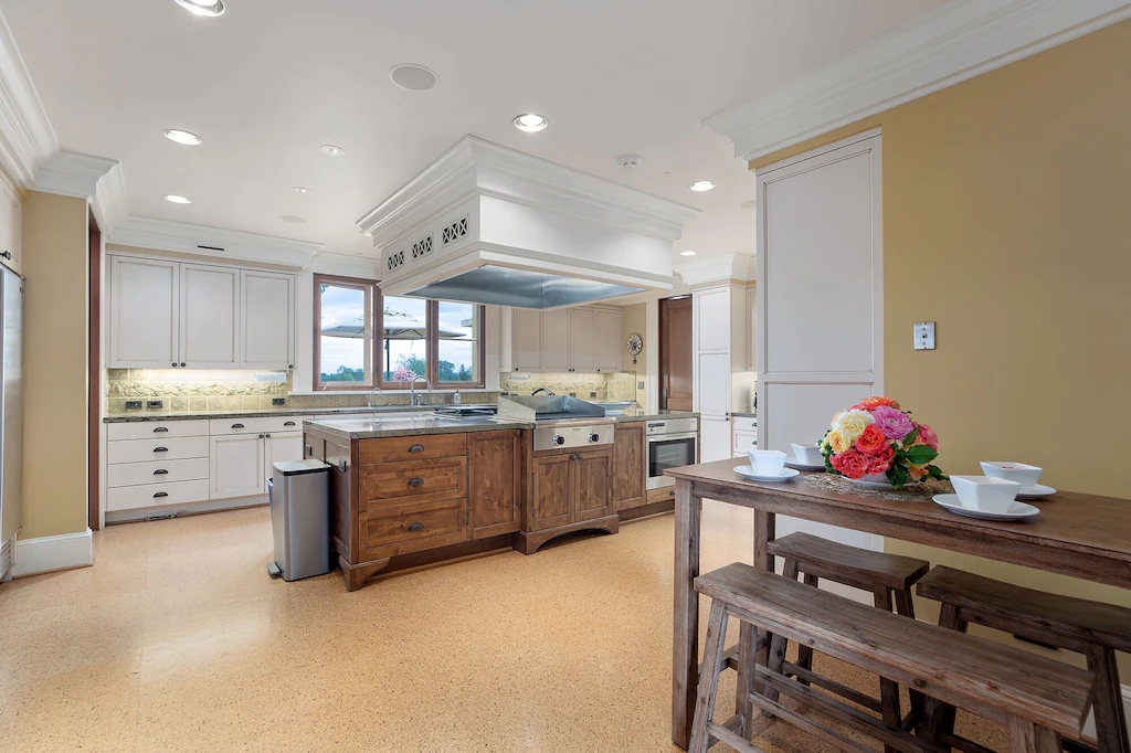 The kitchen is fully equipped with cookware, plates, and serving goods to accommodate 30+ guests.