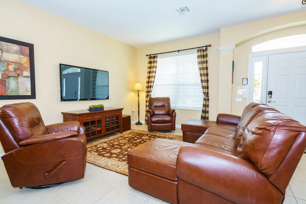 Living room leather recliners and 60' flat screen TV