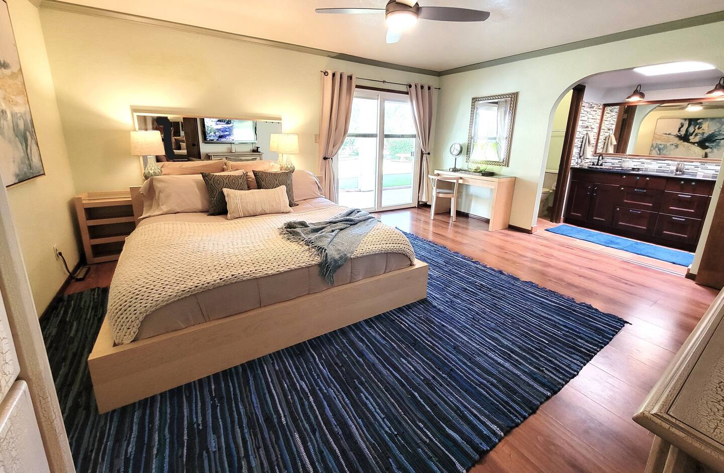 The master bedroom is furnished with a king-sized bed.