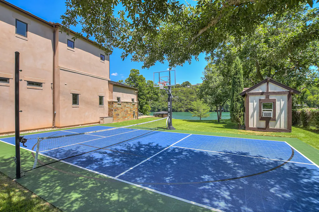 A court designed for sports featuring both basketball and pickleball.