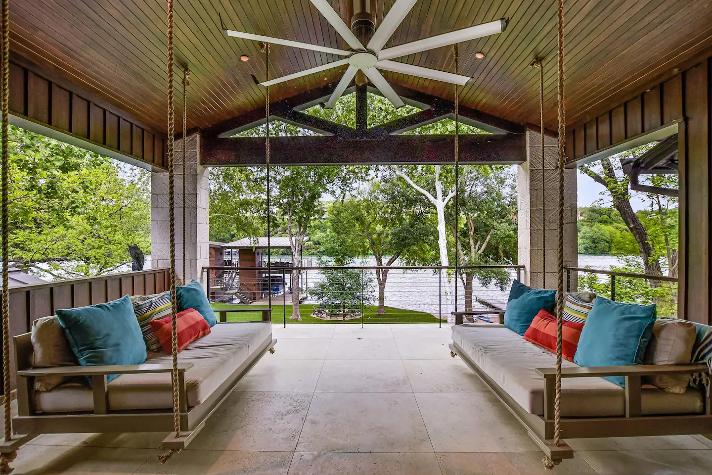 Savor the panoramic lake vista from the spacious balcony porch, complete with daybed swings.
