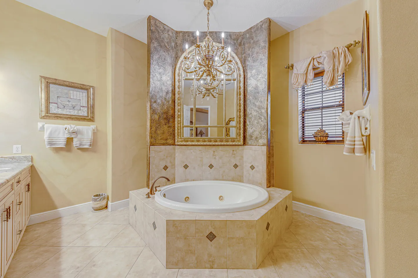 Custom bathroom with whirlpool tub, walk-through shower, and double sinks.