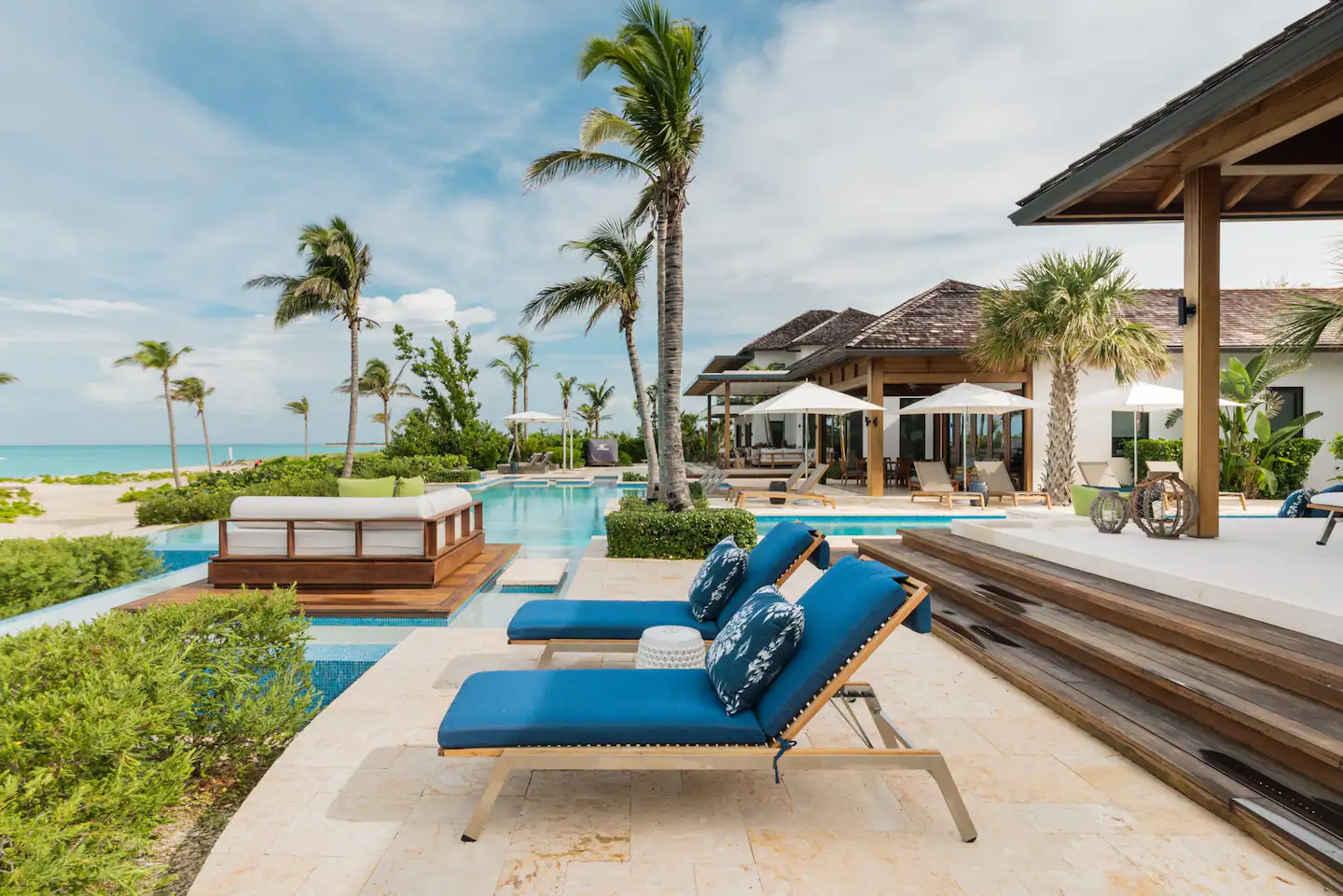 This Grace Bay beauty has a massive infinity pool that connects the house to a hot tub, floating day bed, and the sand and sea beyond.