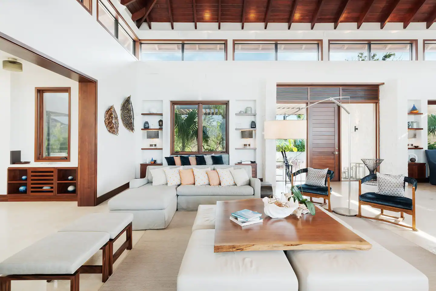 A spacious and elegant living room featuring comfy sofas.