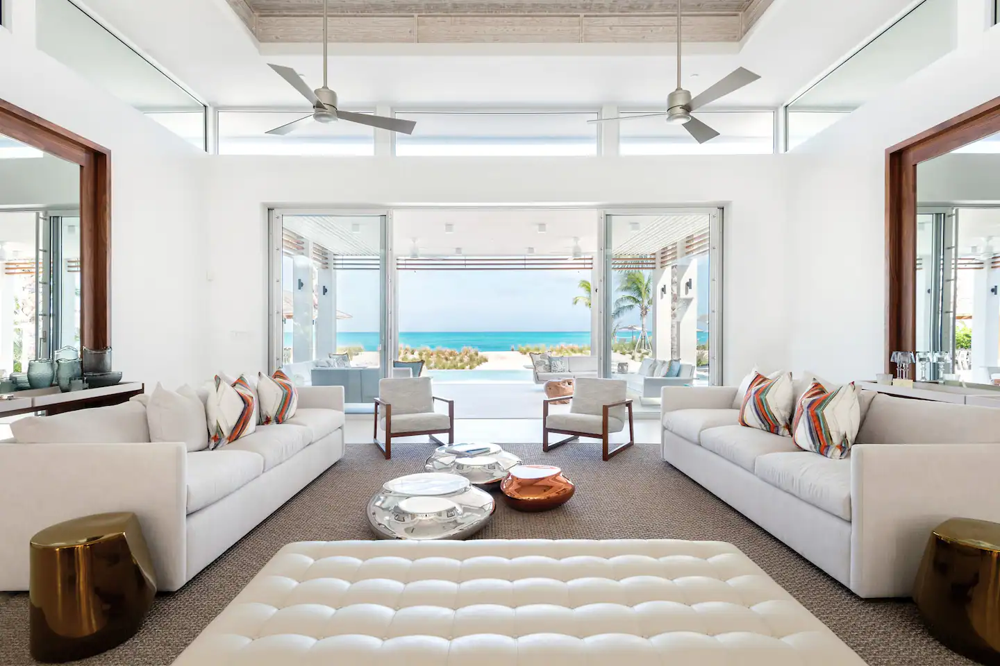 Elegant and clean living room overlooking the crystal-clear waters.