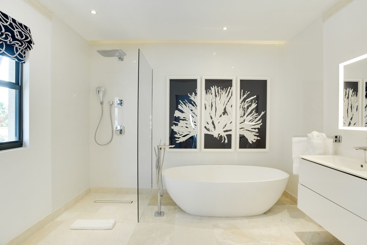 A serene spa bathroom showcasing a spacious bath tub