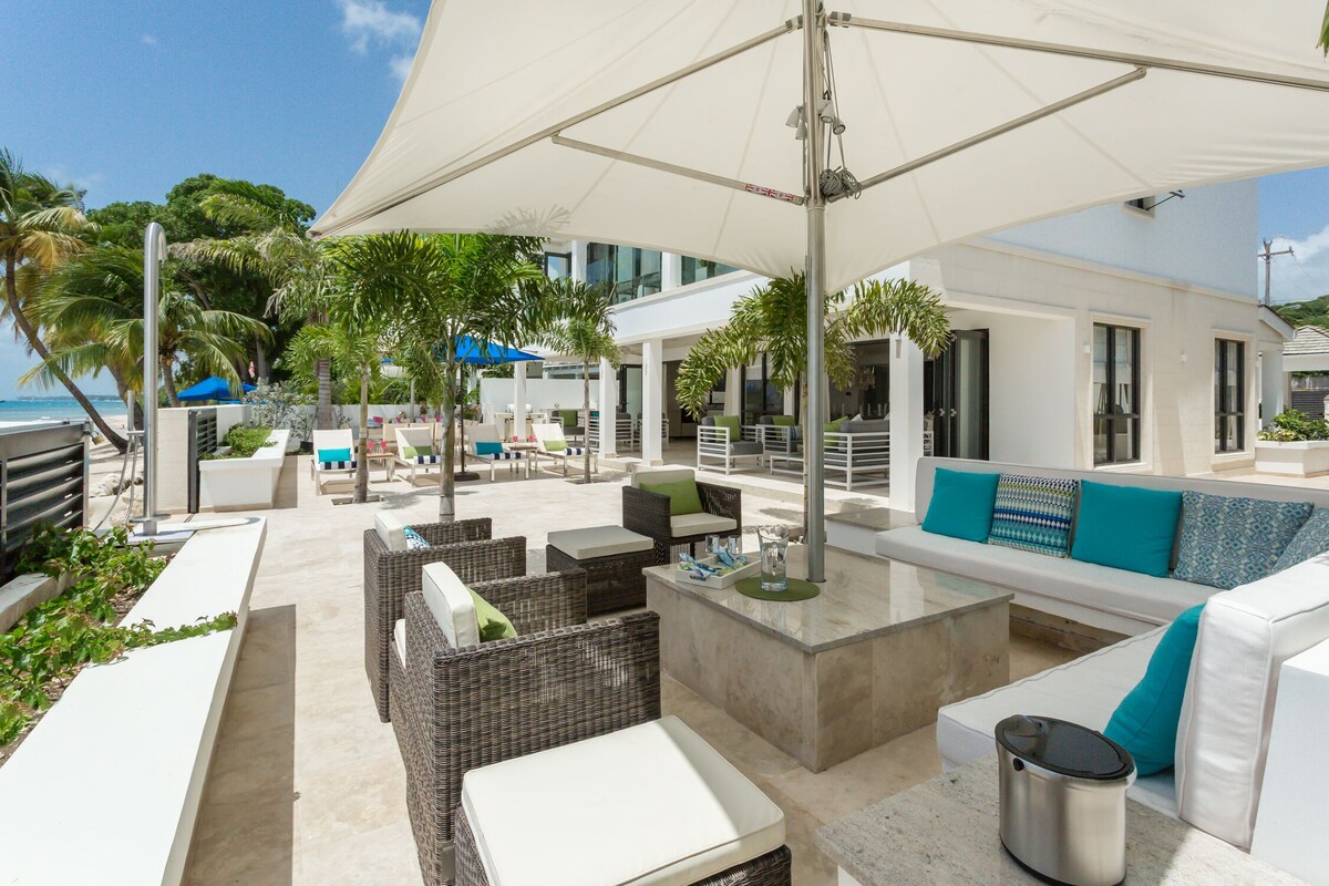 An outdoor lounge area with luxurious sofas.