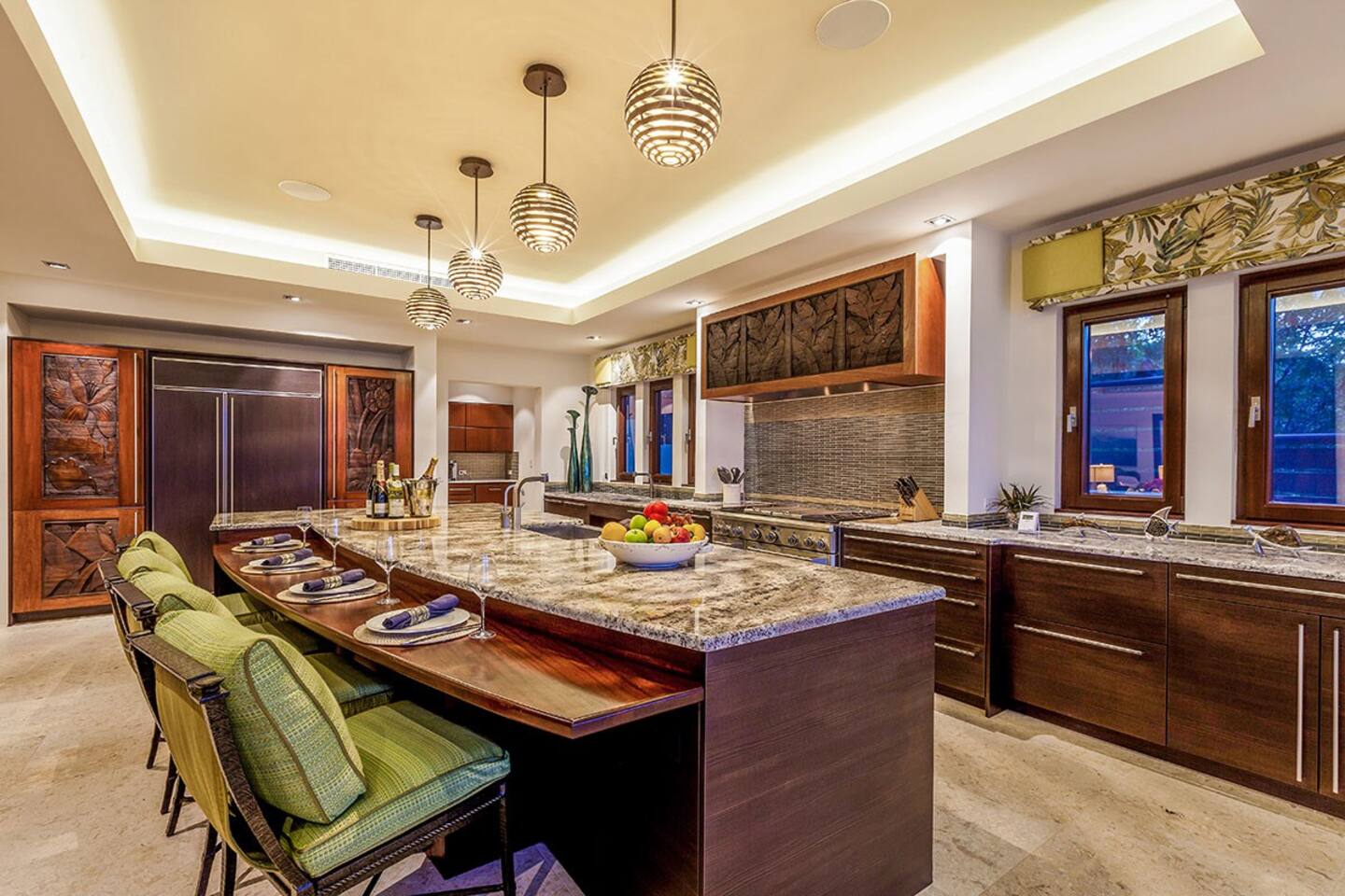 The kitchen features exquisite marble countertops, modern cabinetry, and stylish pendant lights.
