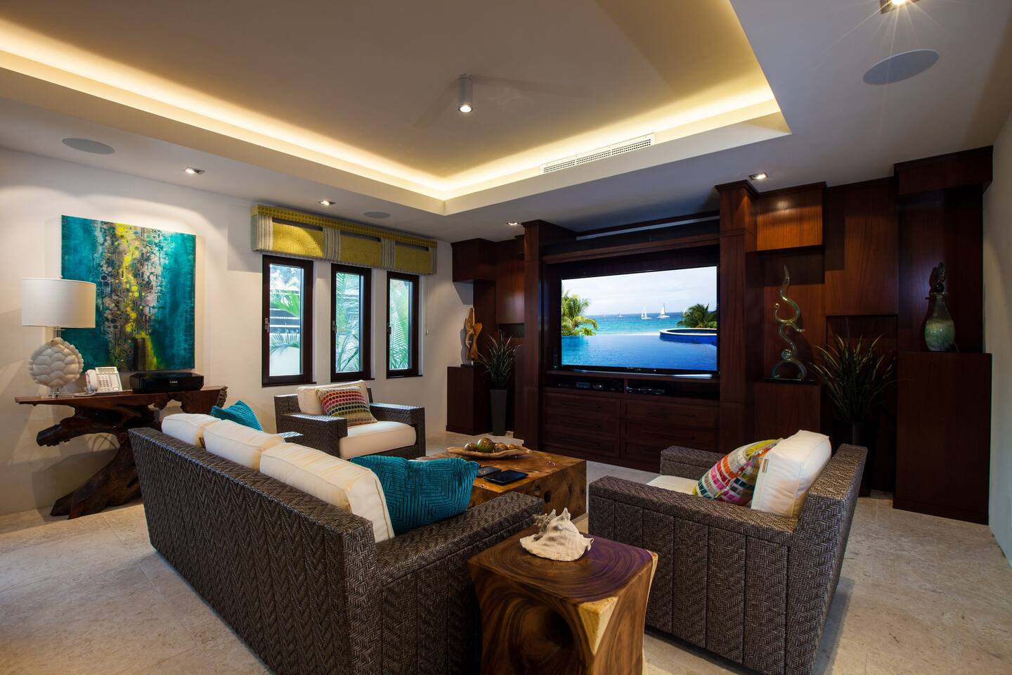 media lounge designed for relaxation and entertainment, furnished with plush seating options such as cozy armchairs.