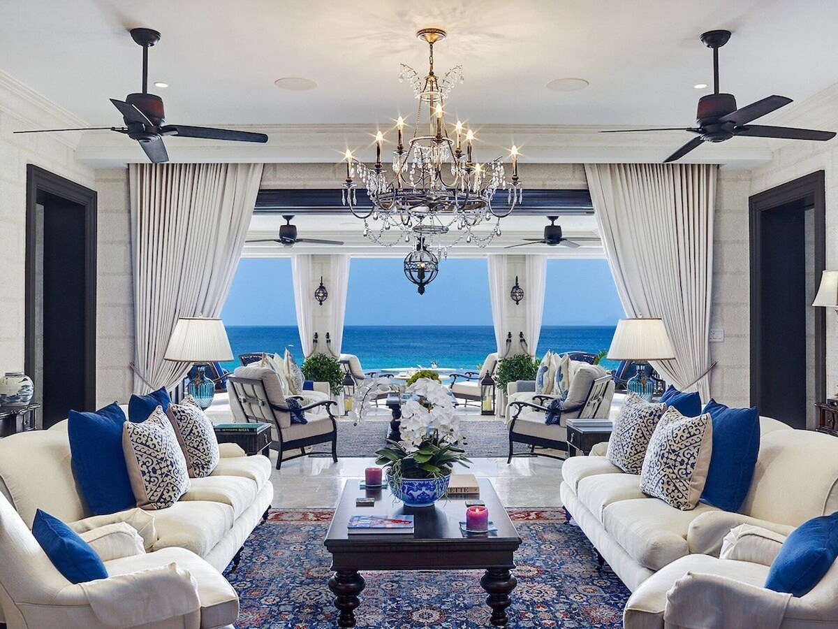 A spacious living room that offer breathtaking panoramic views of the beach.