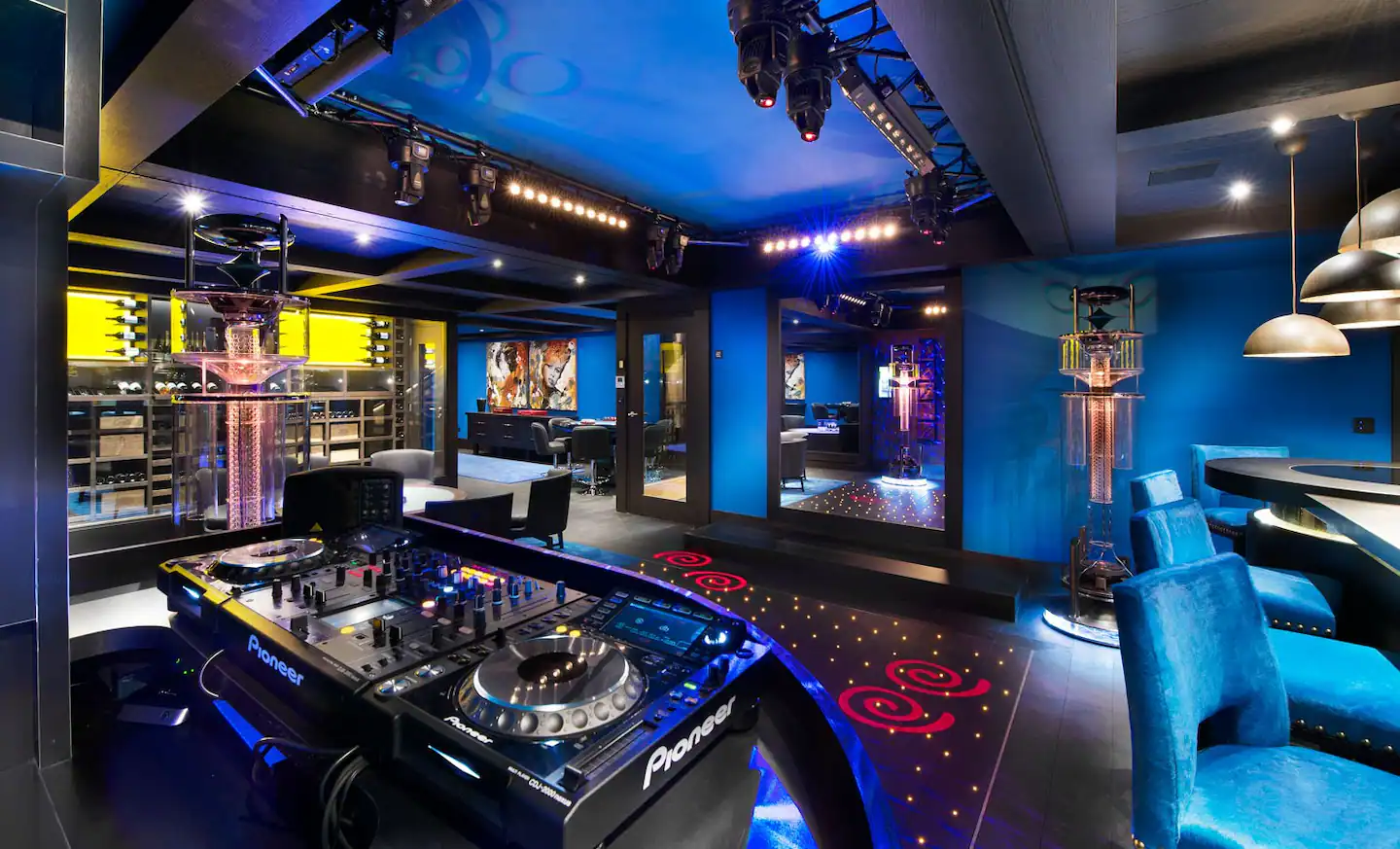 Unleash your inner dancer in the private bar with a dazzling dance floor and DJ booth.