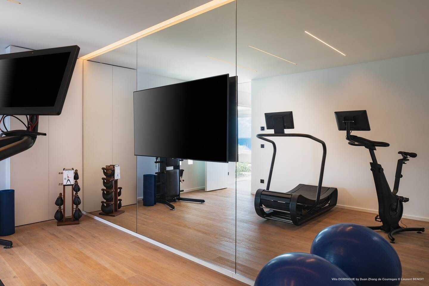 Well-equipped gym facility in the villa, featuring state-of-the-art exercise equipment and ample space for fitness activities.

