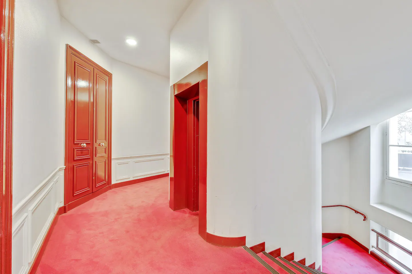 Vibrant red floor on the hallway.