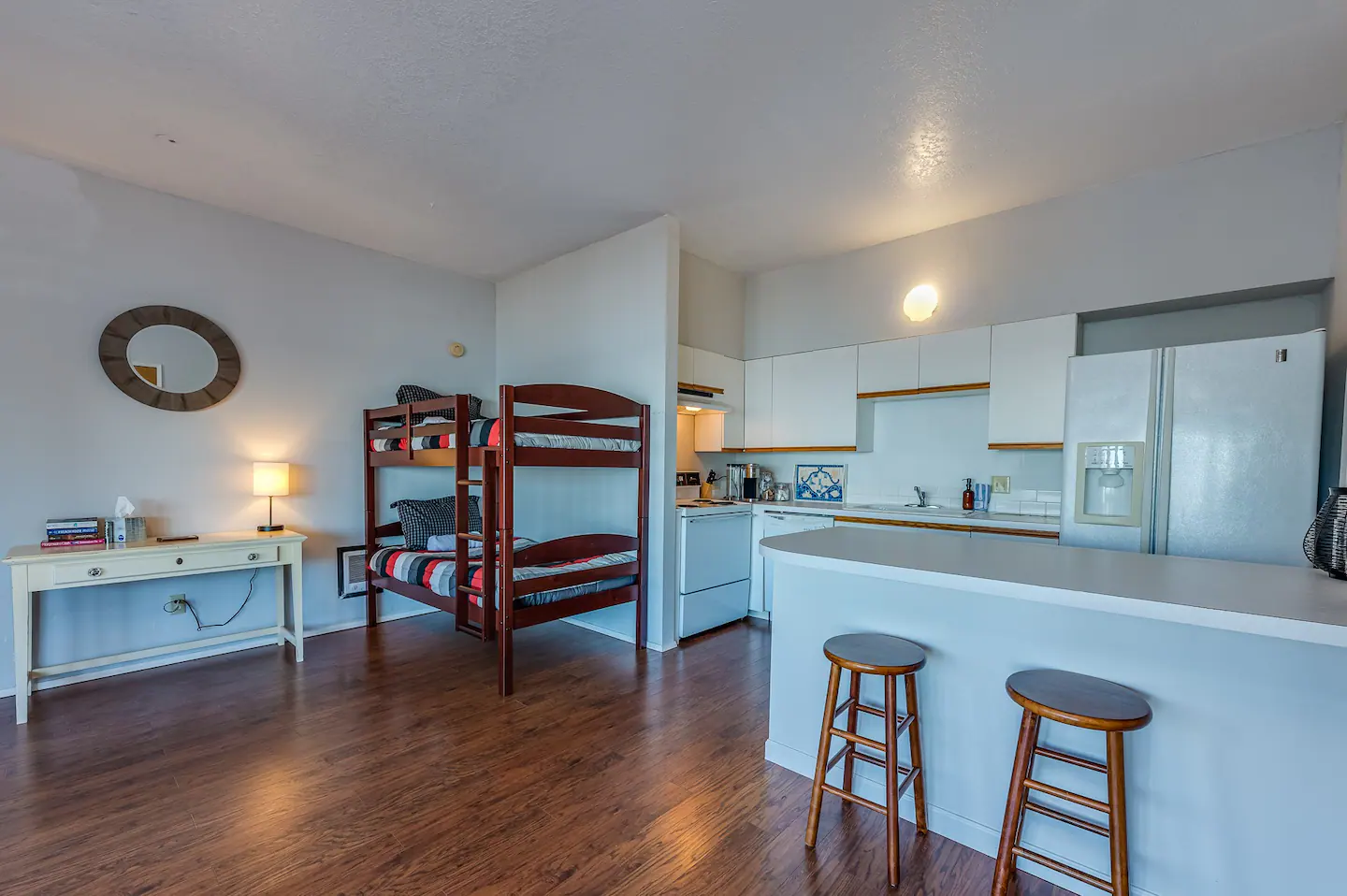 Separate in-law apartment has a bunk bed, writing desk, full kitchen, family room and a master suite with ensuite bath.
