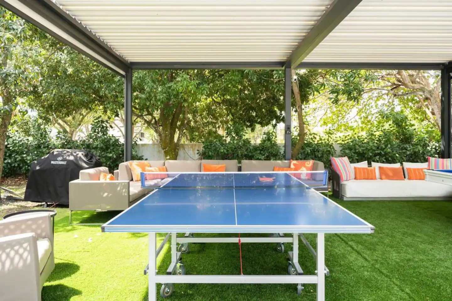 Enjoy a game of pool or table tennis under the shady patio